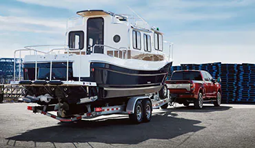 2022 Nissan TITAN Truck towing boat | Neil Huffman Nissan of Frankfort in Frankfort KY